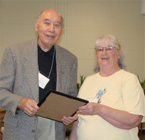 Judy Eckhoff presented James Rasmussen with the
